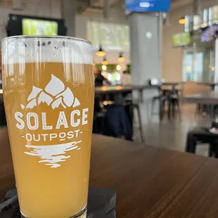 a glass of beer on a table