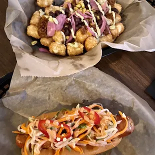two hotdogs with different toppings