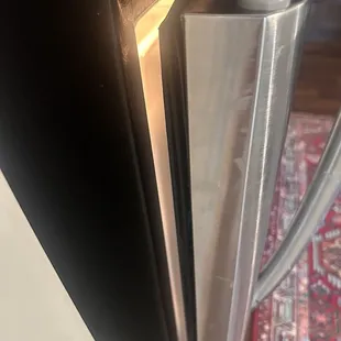 My refrigerator will not close and it is made for a different kitchen so it opens up into the living room instead of the kitchen