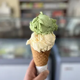 Green tea and chocolate chip ice cream on waffle cone