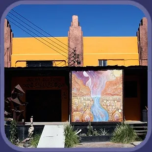 a colorful mural on the side of a building