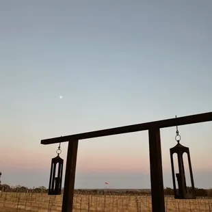 the moon setting over the horizon
