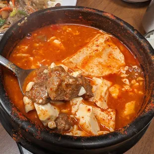 Soon tofu. The menu clearly stated tofu with vegetables (beef or pork). My soup came with just tofu and cubed beef.