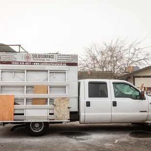 a white truck parked in a lot