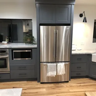 a stainless steel refrigerator in a kitchen