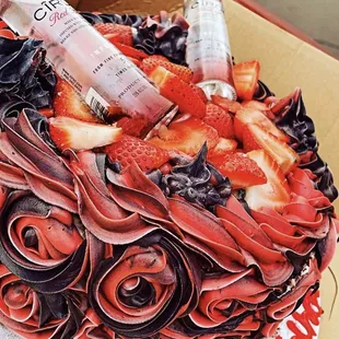 a cake decorated with strawberries and chocolate