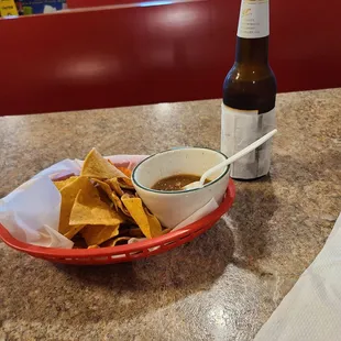 Nice chips and spicy Salsa with Cerveza Frio!