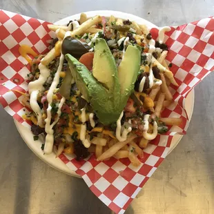 a plate of fries and avocado