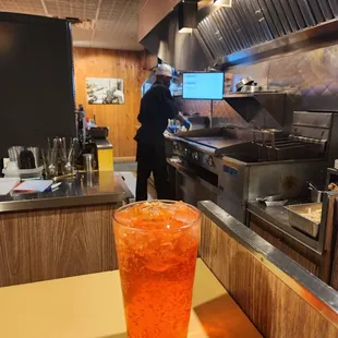 a glass of iced tea on a table