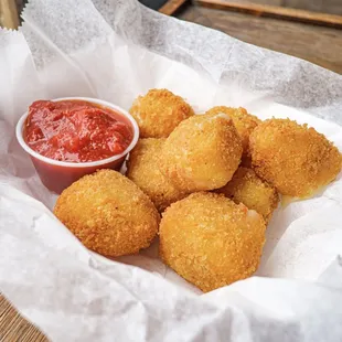 a basket of deep fried chicken nuggies