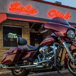 a motorcycle parked in front of a diner