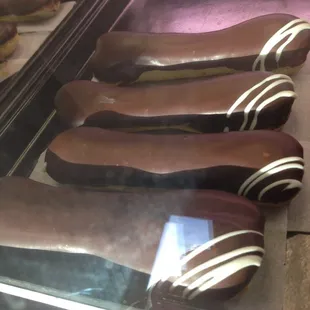 a row of chocolate covered donuts