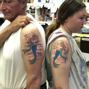 A Father and Daughter custom set of Tattoos made Back To Back at Solomon's Porch Tattoo Parlor.