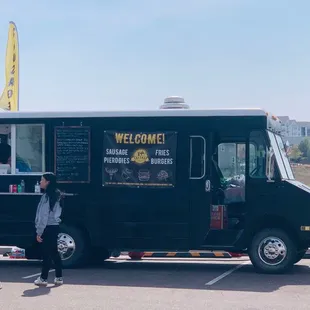 people standing in a parking lot