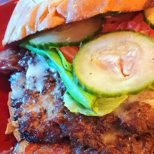 a burger and fries on a red plate