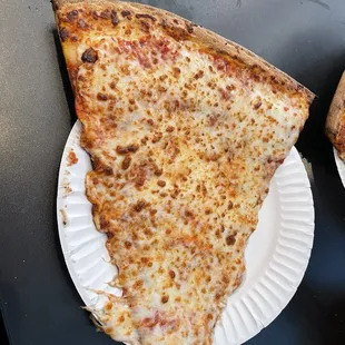 Cheese slice is quite large, crispy crust, decent pizza for a hungry Giants fan after a game