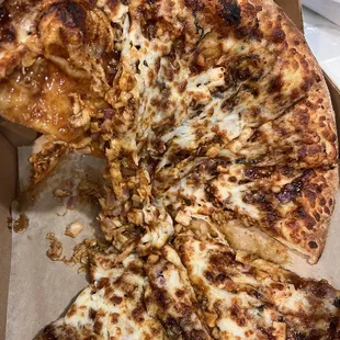 Uncut (we attempted to cut it ourselves) sloppy mess of a $30 pizza. Terrible