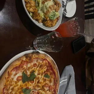 Chicken Caesar salad and margarita pizza
