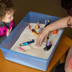 We offer both sand tray and play therapy for families and kids.
