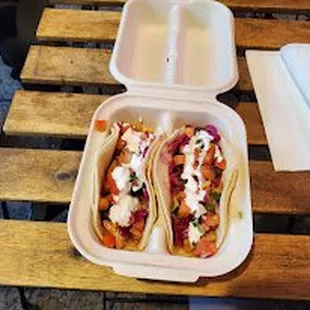 Grilled chicken tacos with pico de gallo, pickled cabbage and sour cream