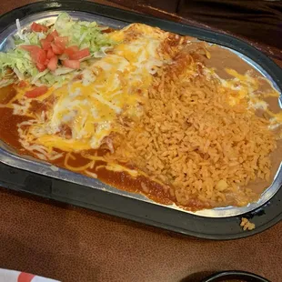 Cheese and Onion enchiladas with refried beans and rice