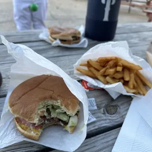 Cheese burger all the way, fries, and a bacon cheeseburger plain.