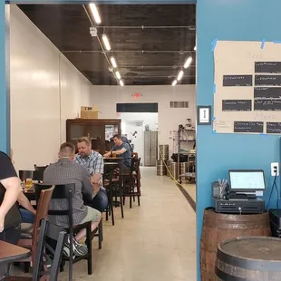 people sitting at tables and working on laptops