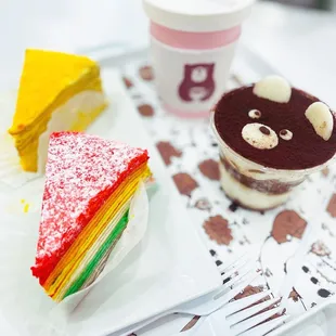 Rainbow and mango crepe cake, tiramisu cup, cafe latte