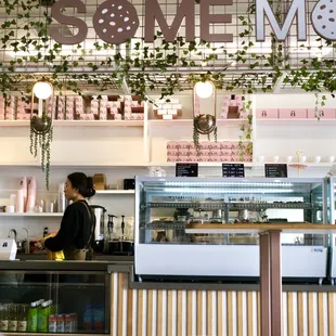 a woman behind a counter