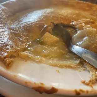 a plate of food with a fork in it