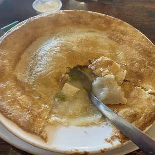 a plate of food with a spoon in it