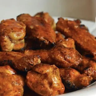 a plate of chicken wings