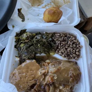 Salsbury steak over rice, smothered too hard. Black eye peas, greens, and cornbread. Smiling when you eat type of plate.