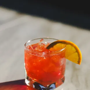 a drink with a slice of orange