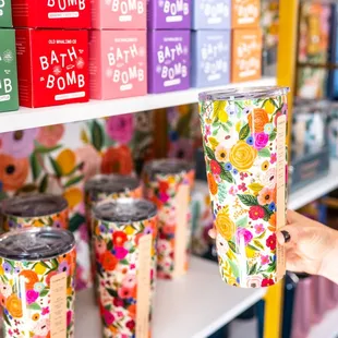 a person holding a cup in a store