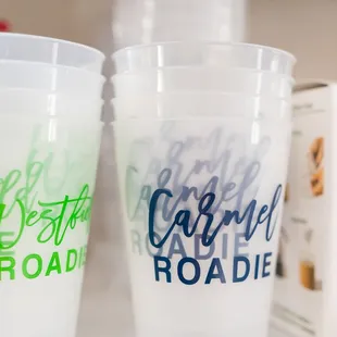 two plastic cups on a shelf