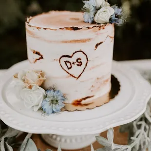 Couple&apos;s wedding cake. We also ordered three other cakes to feed guests.