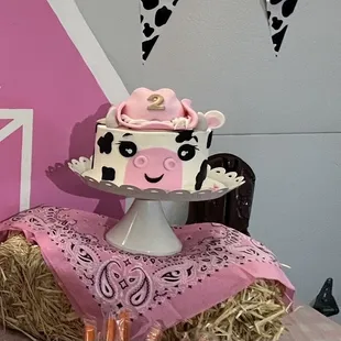 Cow funfetti cake with funfetti icing, and a fondant cowgirl hat.