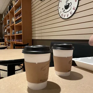 two cups of coffee on a table