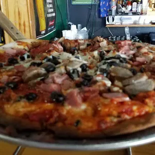 Delicious Meateaters with thin crust and very spicy sauce!