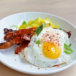 Breakfast Bibimbap - Crispy bacon, fried egg, pickled vegetables, red cabbage, scallion, sriracha, gochujang sauce