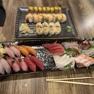 two plates of sushi and chopsticks