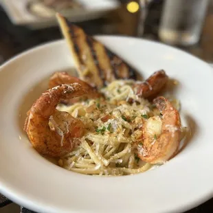 a plate of pasta and shrimp