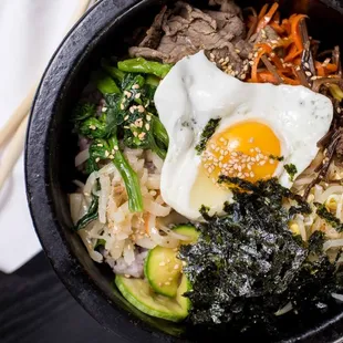 DOLSOT BIBIMBAP Served on hot stone. The crisped rice at the bottom w/ various cooked vegetables, egg, and beef on the top. Served with miso