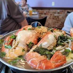 a large plate of seafood and rice