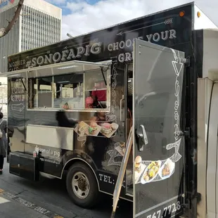 a food truck parked on the side of the road