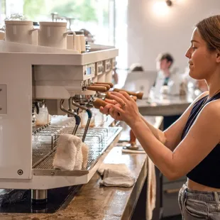 a bari serving a cup of coffee