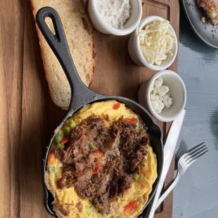 Lamb omelette with cheese on side