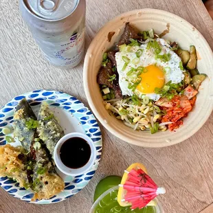 two plates of food and a drink