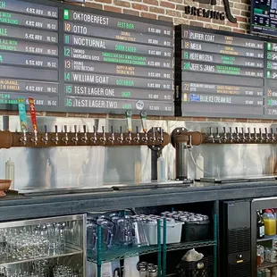 a bar with a menu on the wall